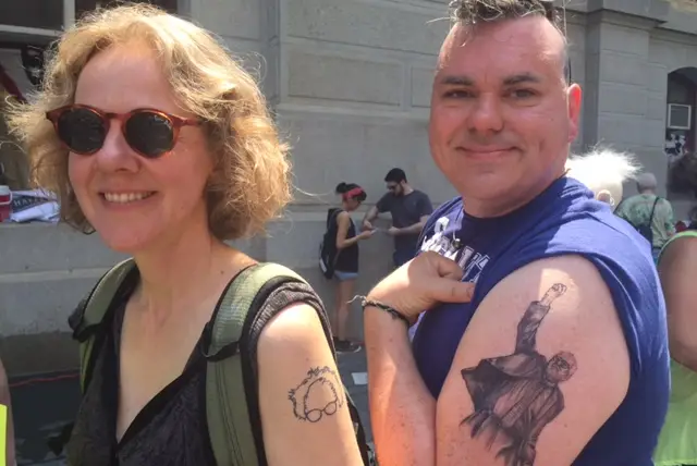 Anna Callahan and Michael Sparks, showing off their Bernie ink.
